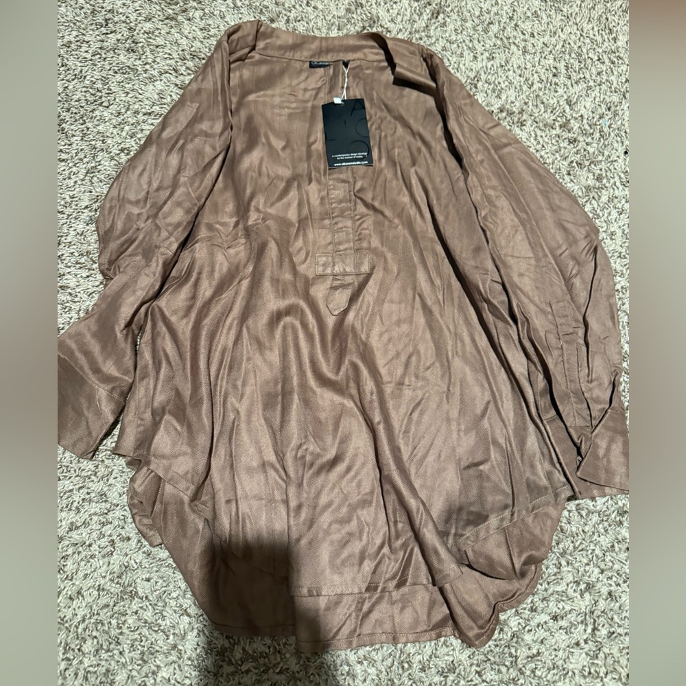 Woman’s blouse with pants. New in perfect condition.